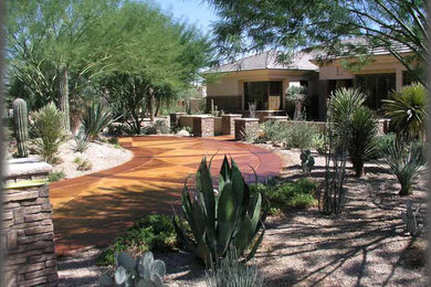 Example of a mid-sized southwest beige one-story mixed siding exterior home design in Phoenix with a hip roof
