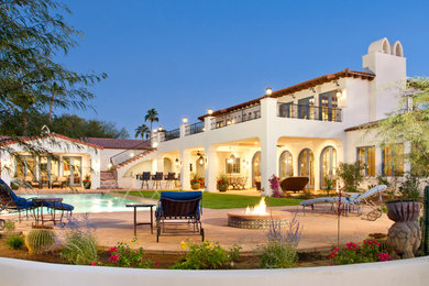 Example of a huge tuscan two-story exterior home design in Phoenix