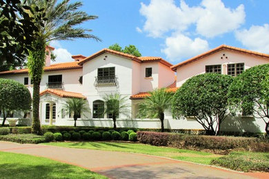 Huge tuscan white three-story stucco exterior home photo in Orlando