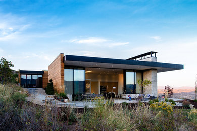 Modern split-level wood flat roof idea in Salt Lake City