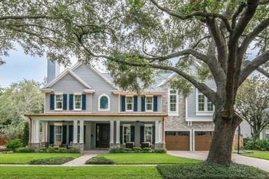 Inspiration for a large transitional two-story exterior home remodel in Tampa