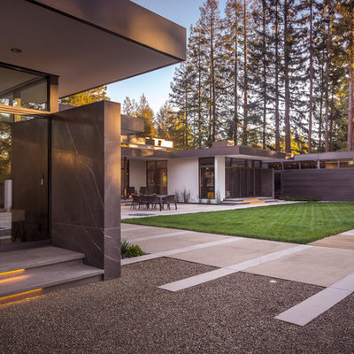 Inspiration for a large contemporary black one-story stone flat roof remodel in San Francisco