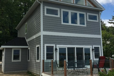 Inspiration for a large craftsman gray two-story mixed siding exterior home remodel in Chicago with a mixed material roof