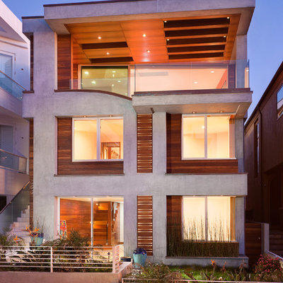 Inspiration for a mid-sized contemporary gray three-story concrete flat roof remodel in Los Angeles