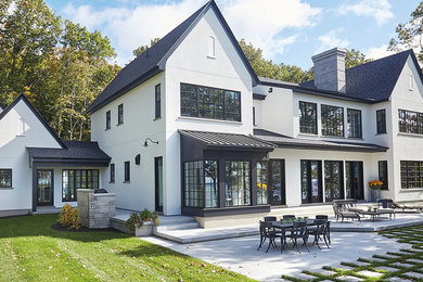 Mid-sized arts and crafts gray one-story wood exterior home photo in Chicago with a shingle roof