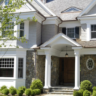 Example of a classic stone exterior home design in New York