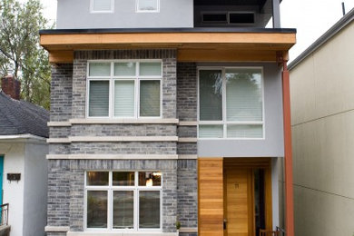 Trendy three-story exterior home photo in Toronto