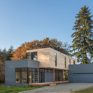 Idee per la facciata di una casa piccola moderna a due piani con rivestimenti misti e tetto piano