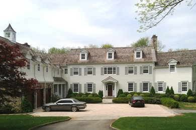 Large transitional beige three-story wood exterior home photo in New York