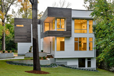 Large minimalist white two-story mixed siding exterior home photo in Atlanta