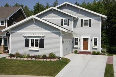 Small craftsman gray two-story wood exterior home idea in Other with a shingle roof
