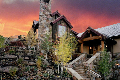 Inspiration for a huge rustic brown split-level mixed siding exterior home remodel in Denver with a shingle roof