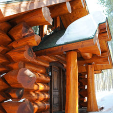 Rustic Exterior by Mountain Log Homes of CO, Inc.