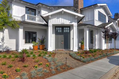 Example of a farmhouse exterior home design in Los Angeles
