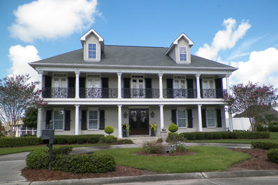 This is an example of a large and gey traditional two floor render terraced house in New Orleans with a shingle roof.