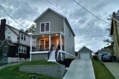 Small transitional gray two-story concrete fiberboard exterior home idea in Cincinnati with a shingle roof