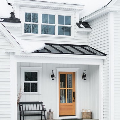 Mid-sized country white two-story vinyl exterior home idea in Portland Maine with a mixed material roof