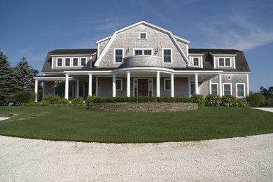 Inspiration for a large timeless gray two-story house exterior remodel in Boston