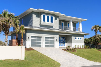 Large beach style gray two-story mixed siding house exterior photo in Jacksonville with a shingle roof