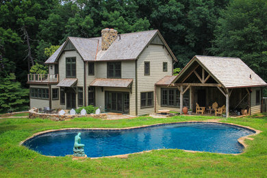 Photo of a beige and large traditional two floor detached house in Philadelphia with wood cladding, a pitched roof and a shingle roof.