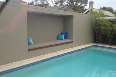 Photo of a medium sized modern house exterior in Sydney with concrete fibreboard cladding.