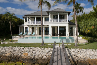 Example of an island style exterior home design in Miami