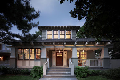 Example of an arts and crafts green two-story exterior home design in DC Metro