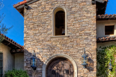 Example of a tuscan exterior home design in Orange County