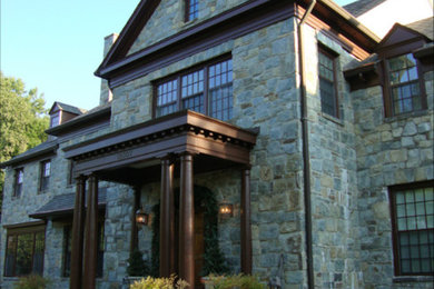 Example of a large transitional gray two-story stone exterior home design in DC Metro