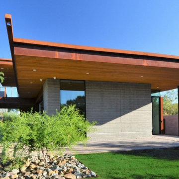 Pre-finished cedar wood ceilings and soffits add warmth to this modern design