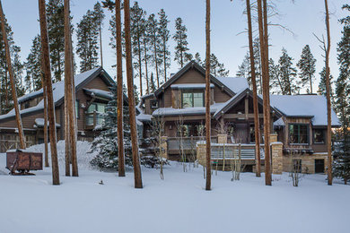 Example of a mountain style brown wood exterior home design in Denver