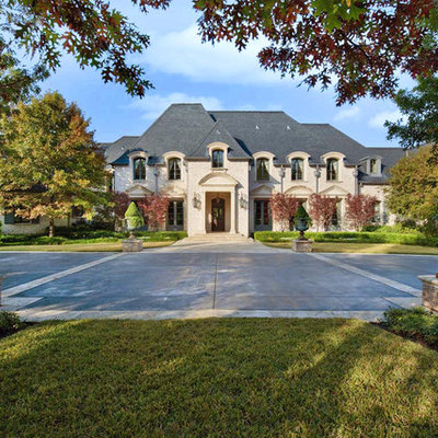 Example of a classic stone exterior home design in Dallas