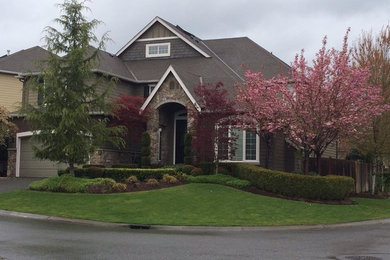 Inspiration for a large and brown traditional two floor house exterior in Columbus with mixed cladding.