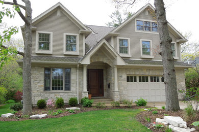 Large arts and crafts beige two-story mixed siding exterior home photo in Chicago with a shingle roof