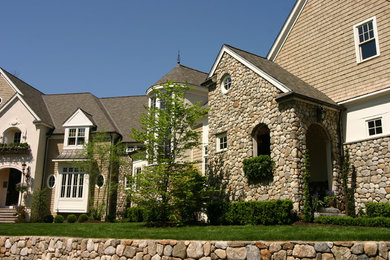 Example of a tuscan exterior home design in Boston