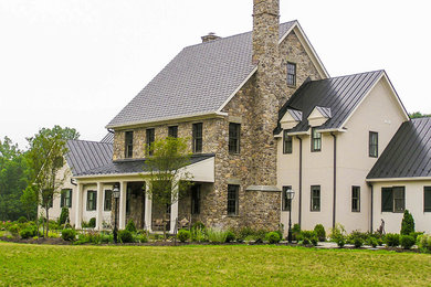 Large farmhouse beige two-story mixed siding gable roof idea in DC Metro