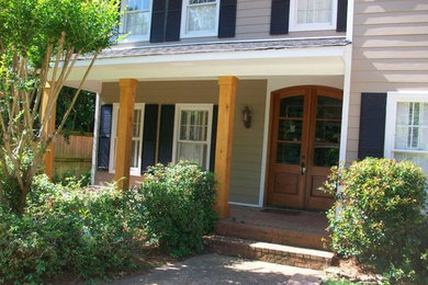 Inspiration for a mid-sized transitional beige two-story vinyl exterior home remodel in Jackson