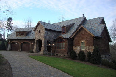 Inspiration for a large brown two-story wood exterior home remodel in Other