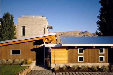 Mid-sized trendy multicolored two-story mixed siding exterior home photo in Boise with a metal roof