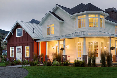 Huge cottage white two-story mixed siding exterior home photo in Salt Lake City with a shingle roof
