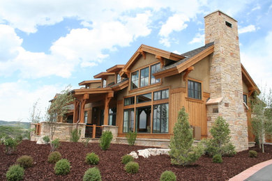 Inspiration for a large country brown two-story mixed siding exterior home remodel in Salt Lake City with a shingle roof