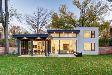 Идея дизайна: большой, двухэтажный, белый частный загородный дом в современном стиле с облицовкой из бетона и плоской крышей