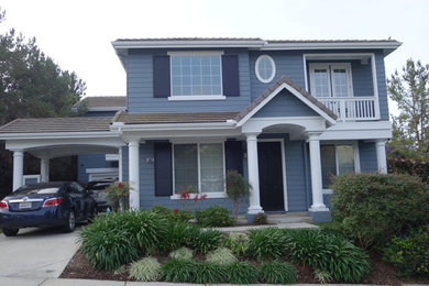 Example of a huge classic blue two-story mixed siding exterior home design in San Diego