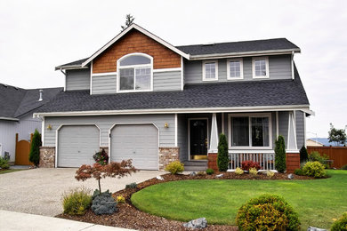 Large traditional gray two-story mixed siding exterior home idea in Newark