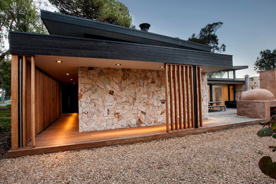 Mittelgroßes, Einstöckiges Modernes Haus mit Steinfassade und schwarzer Fassadenfarbe in Adelaide
