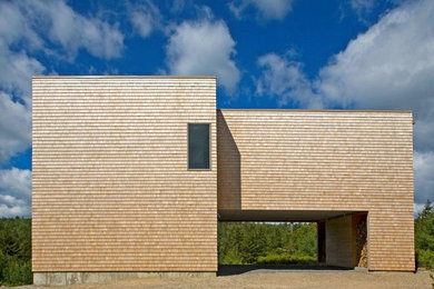 Idee per la facciata di una casa contemporanea di medie dimensioni con rivestimento in legno