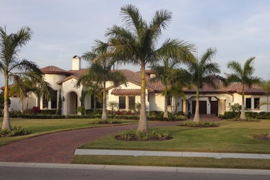 Example of a large tuscan exterior home design in Tampa