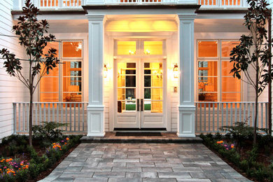 Example of a tuscan white vinyl exterior home design in San Francisco