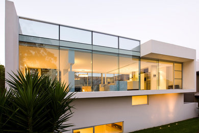 Modelo de fachada de casa minimalista de dos plantas con tejado plano