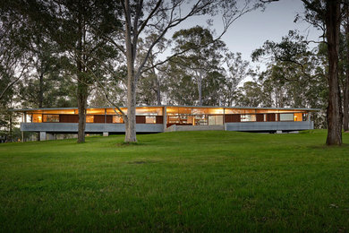 This is an example of a large modern bungalow house exterior in Sydney with a pitched roof.